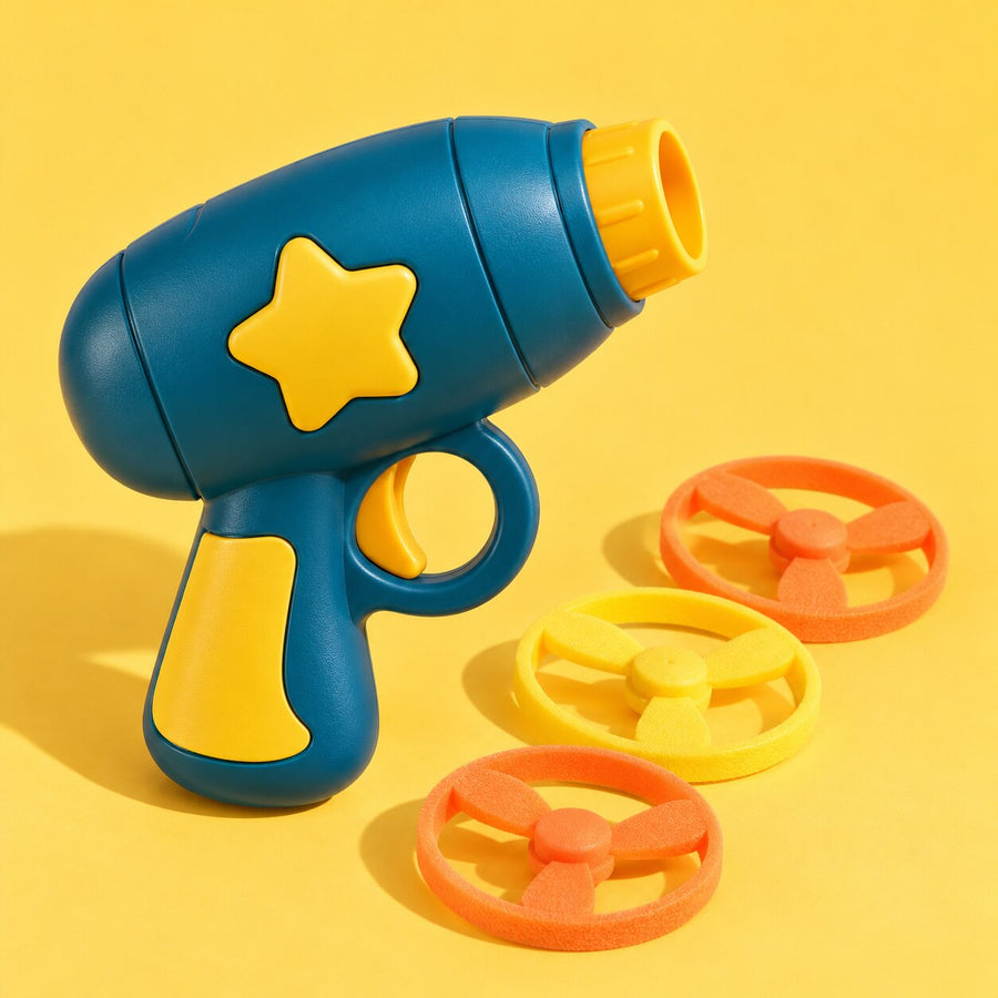 A teal toy disc launcher with three soft foam discs