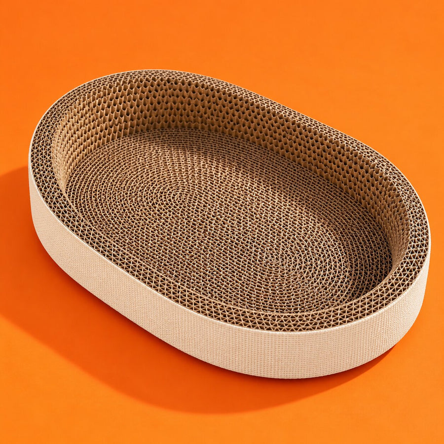 An oval cardboard cat scratcher lounge on orange
